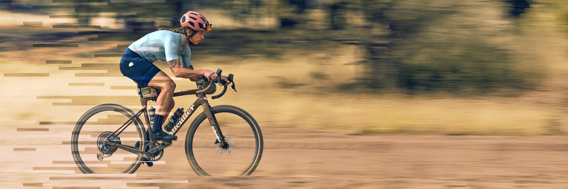 Cyclist riding drop bar gravel bike fast pan photo Teravail Circos Gravel Wheels, Updraft Tire and tubeless valve